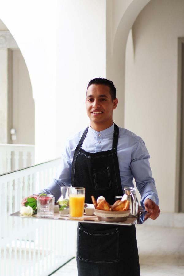 Dar El Jeld Hotel And Spa Tunis Exterior photo A room service attendant